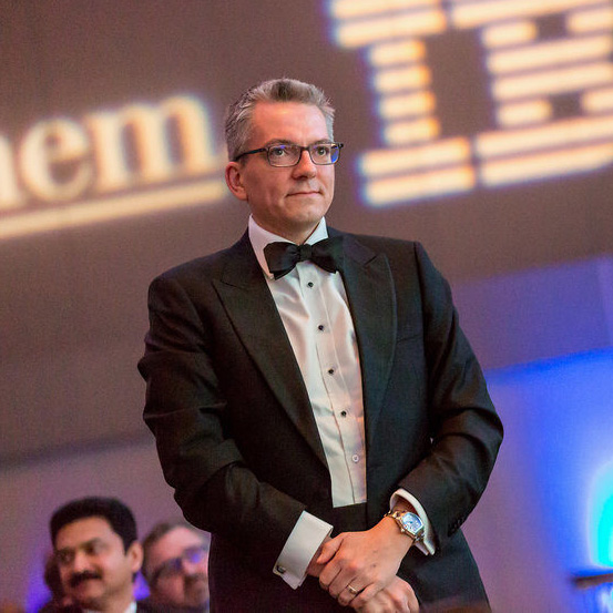 Man in formalwear, Digital Ball 2018, IBM logo in background