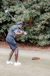 Golfer readying for a swing, Tee IT Up for TechBridge 2021