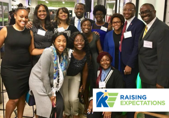 Group Photo with caption “Raising Expectations”