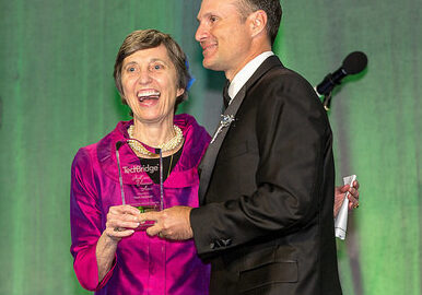 Ann Cramer of Coxe Curry & Associates presents the Ann Cramer Volunteer Award to Mark Farbman (SSI)